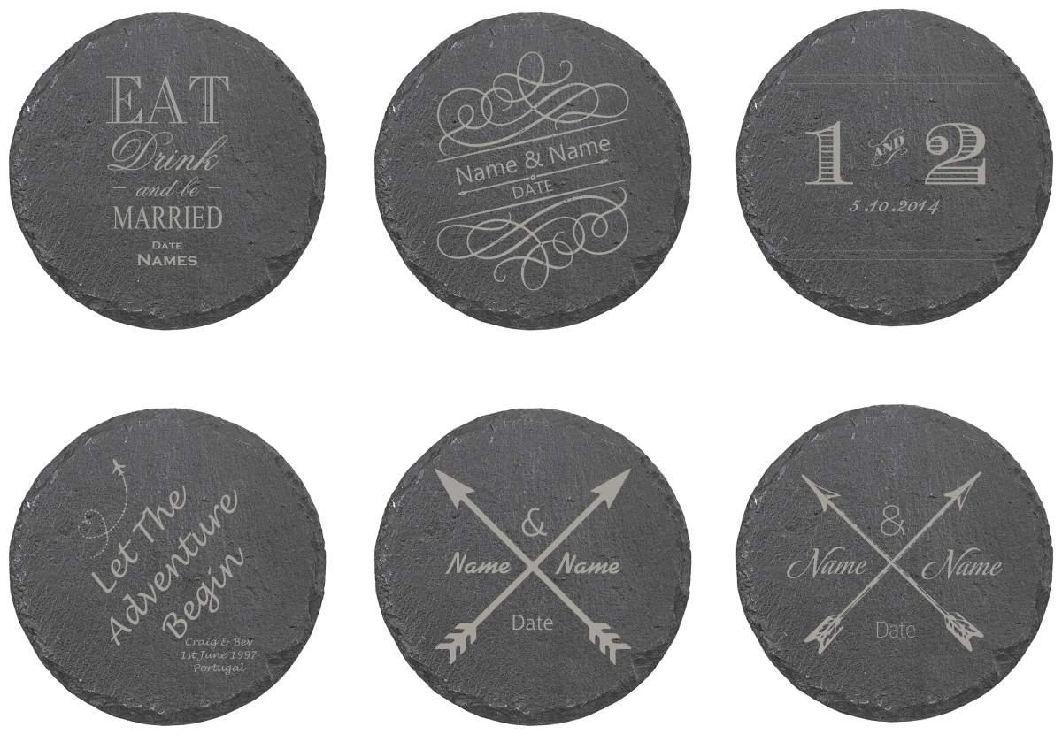 Six round dark gray slate coasters arranged in two rows on a white background, each engraved with different wedding-themed designs including 'EAT Drink and be MARRIED', 'Name & Name DAT', numbers '1 & 2', 'Let the Adventure begin', crossed arrows with 'Name & Name Date', and arrows with 'Name & Date'.
