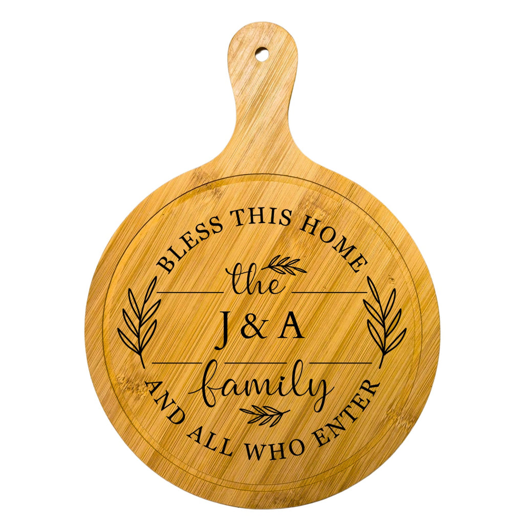 Round bamboo cutting board laser engraved with "Bless This Home and All Who Enter" and custom family name – personalized gift by MSC Wood & Craft Designs