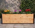 Rectangular wooden planter box with metal corner accents filled with colorful flowers