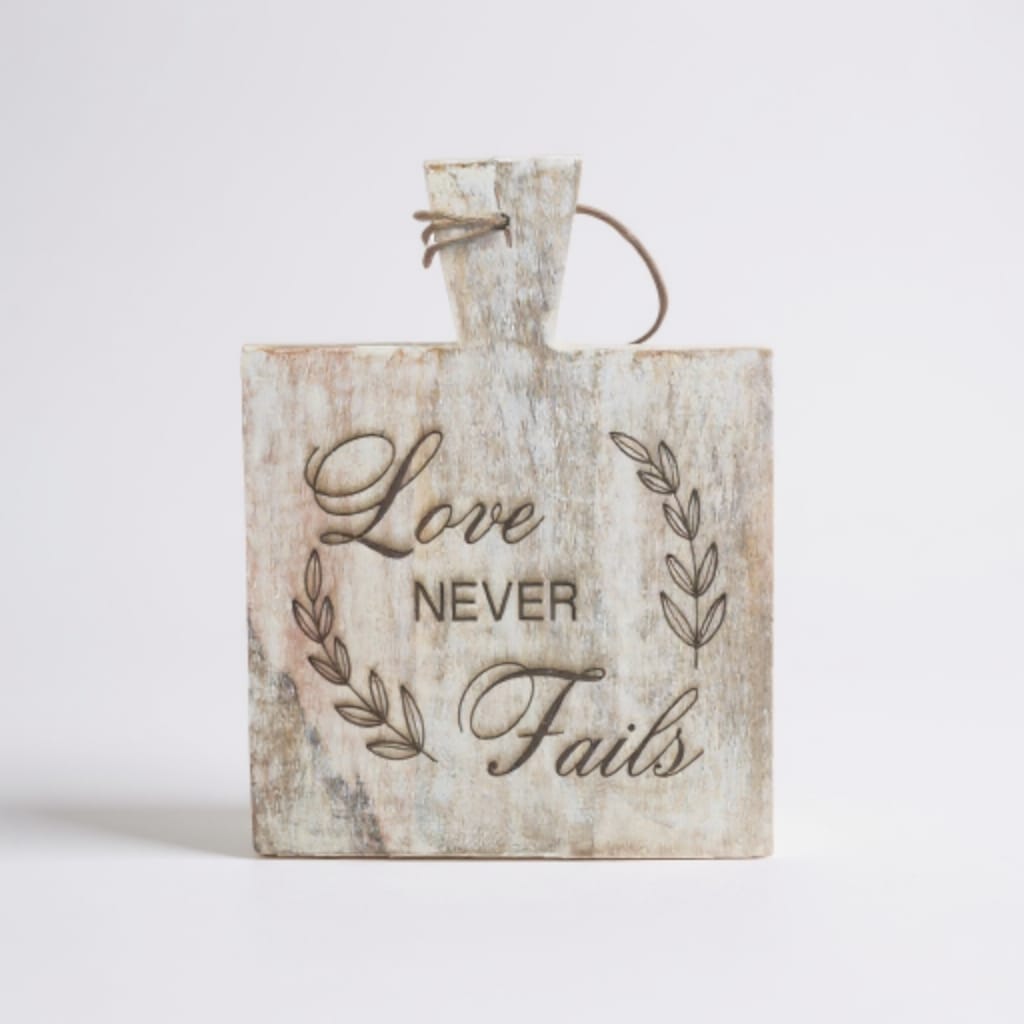 Decorative laser engraved wooden sign with Love Never Fails quote