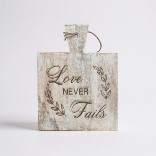 Decorative laser engraved wooden sign with Love Never Fails quote