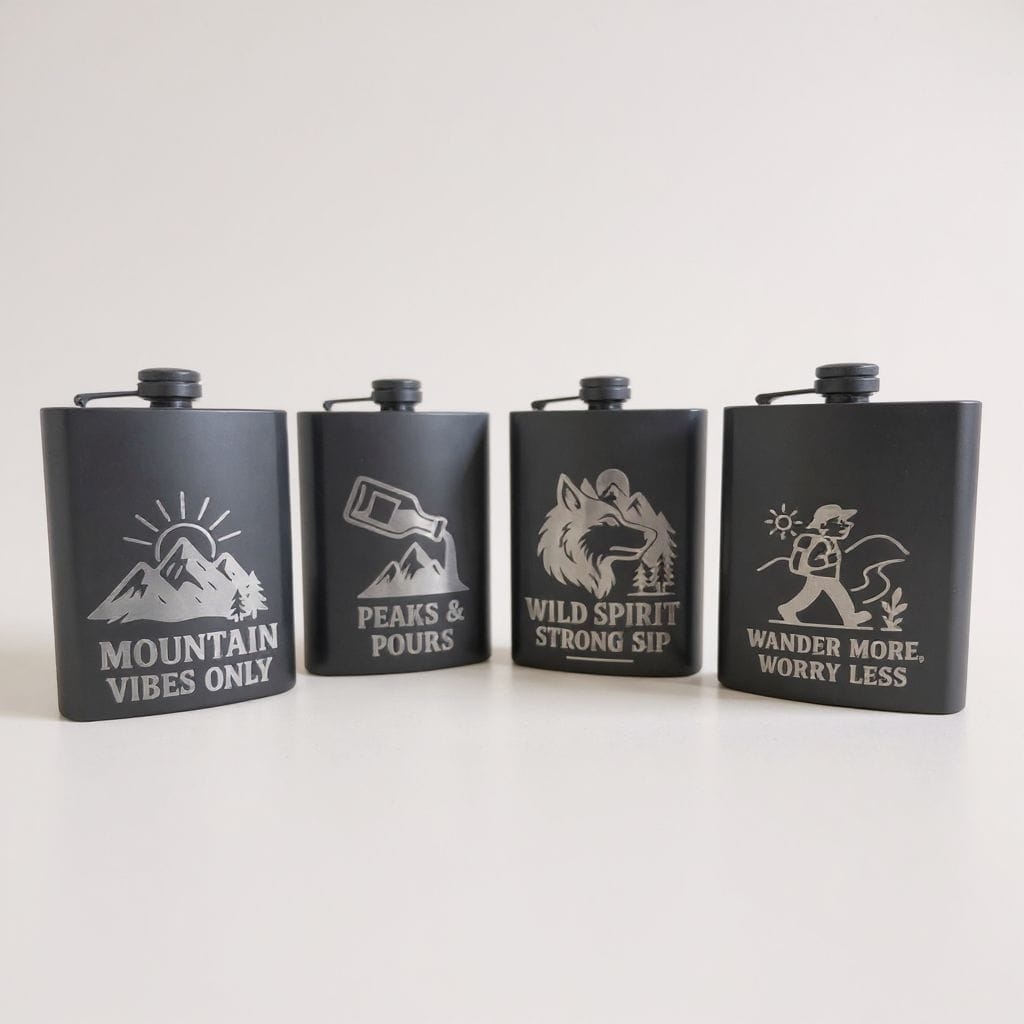 Laser engraved matte black stainless steel flasks with adventure designs